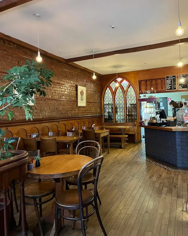 Cozy interior of Potpourri Café with warm lighting and comfortable seating